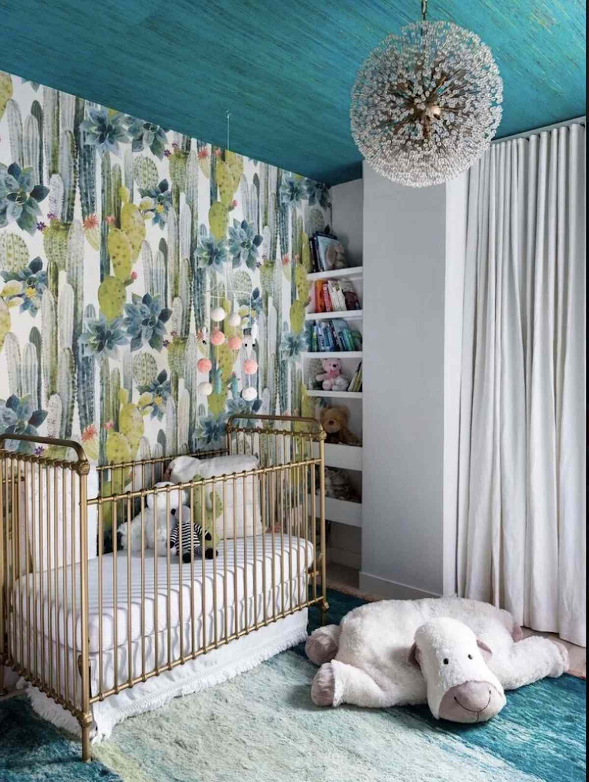 blue and green nursery with small nook that has built in shelves