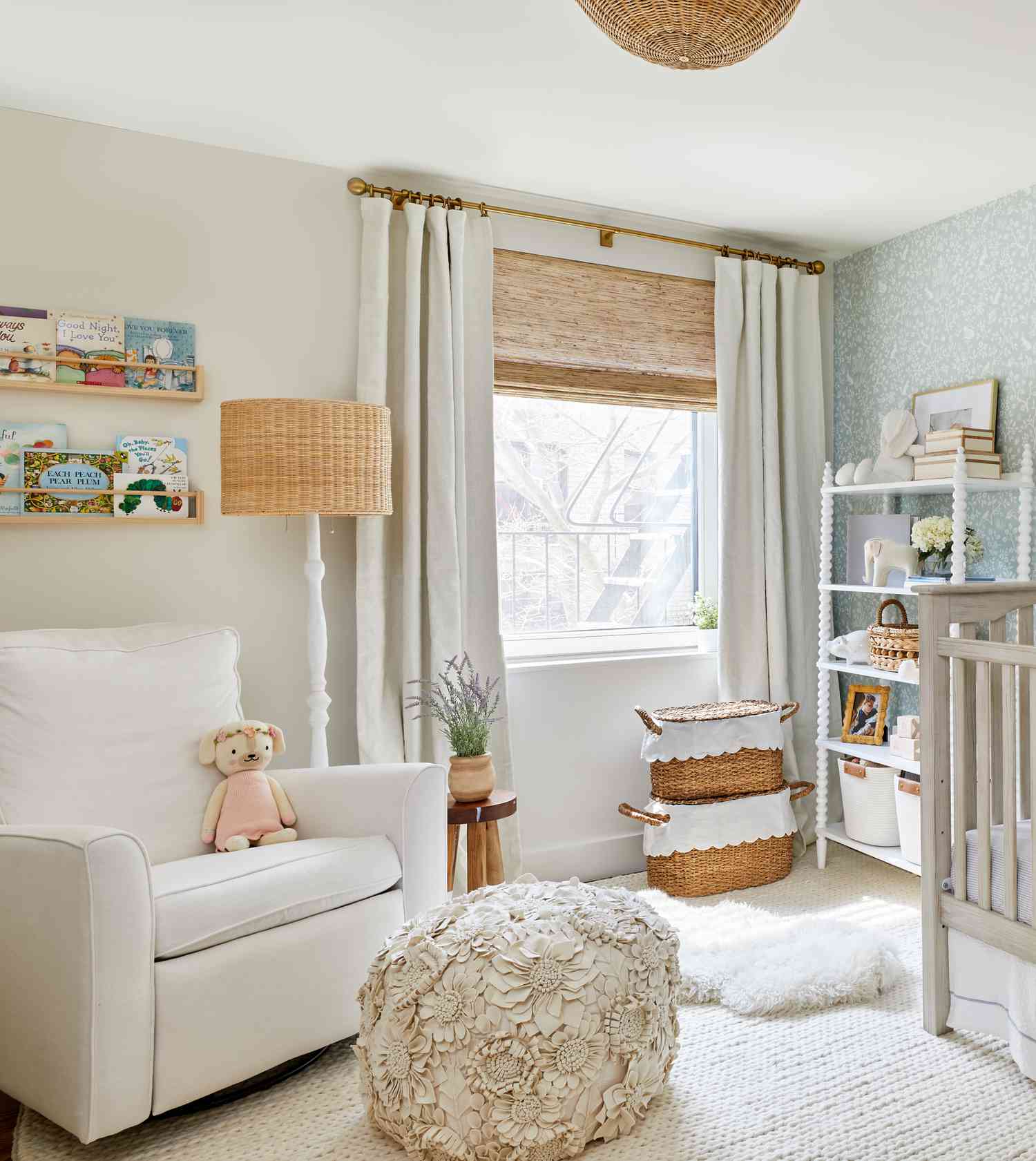 nursery with chair, cream white interior, with book ledges installed above chair