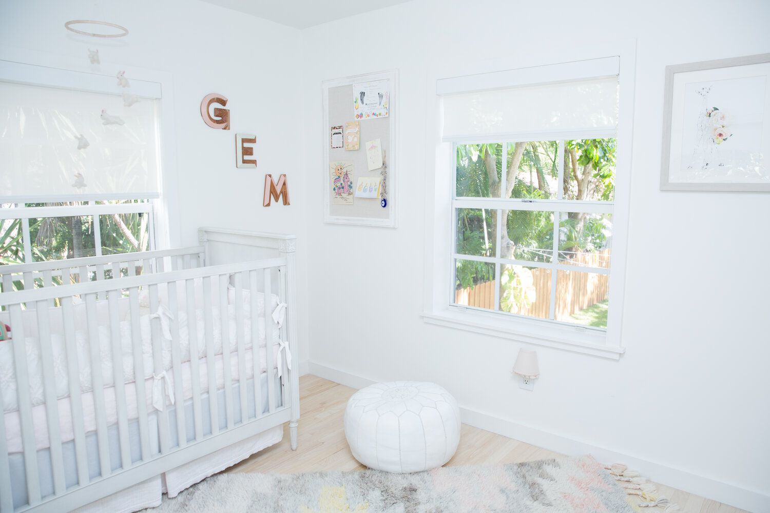 white nursery with open windows and plenty of natural light