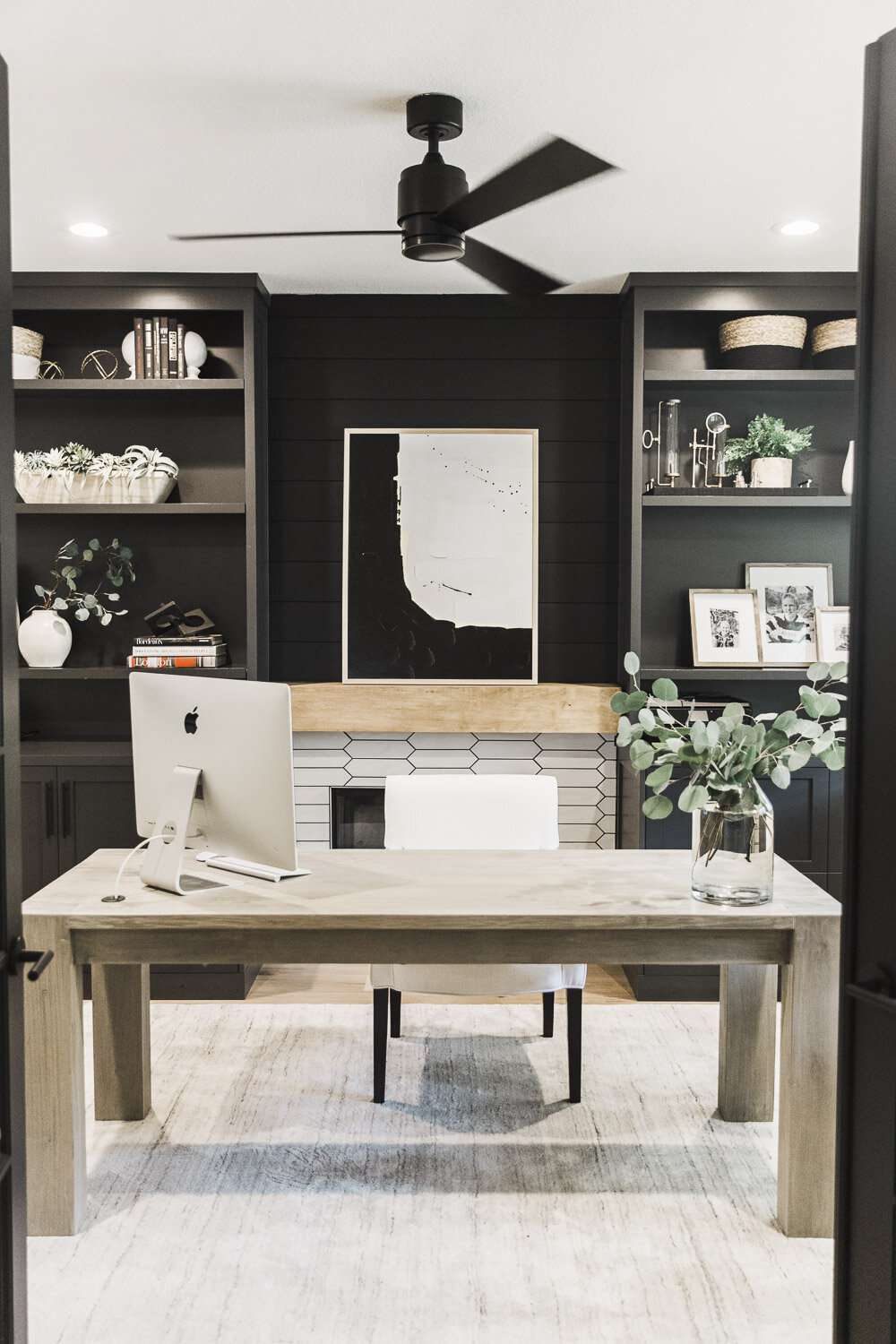 Working from Home? 8 Design Tips for a More Functional Office, According to Designers 4 Home office with built-ins and a fireplace accent wall.