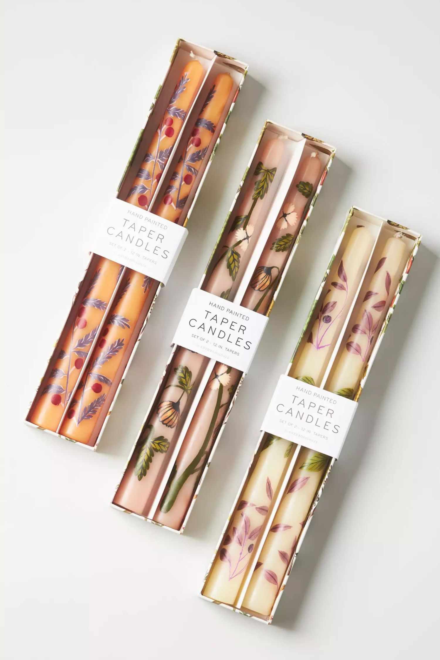 14 Herbstdekorationen von Anthropologie, die Sie nicht verpassen sollten, alle unter 20 $ 24 Drei Sätze handbemalter Spitzkerzen in herbstlichen Mustern und Farben