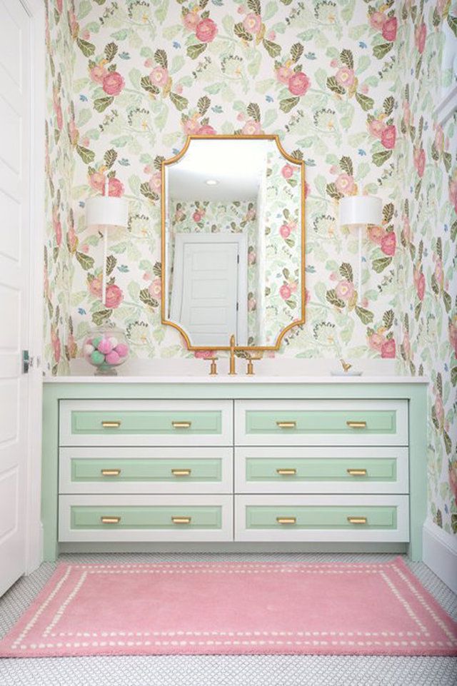 Floral wallpaper and mint green vanity in kids' bathroom