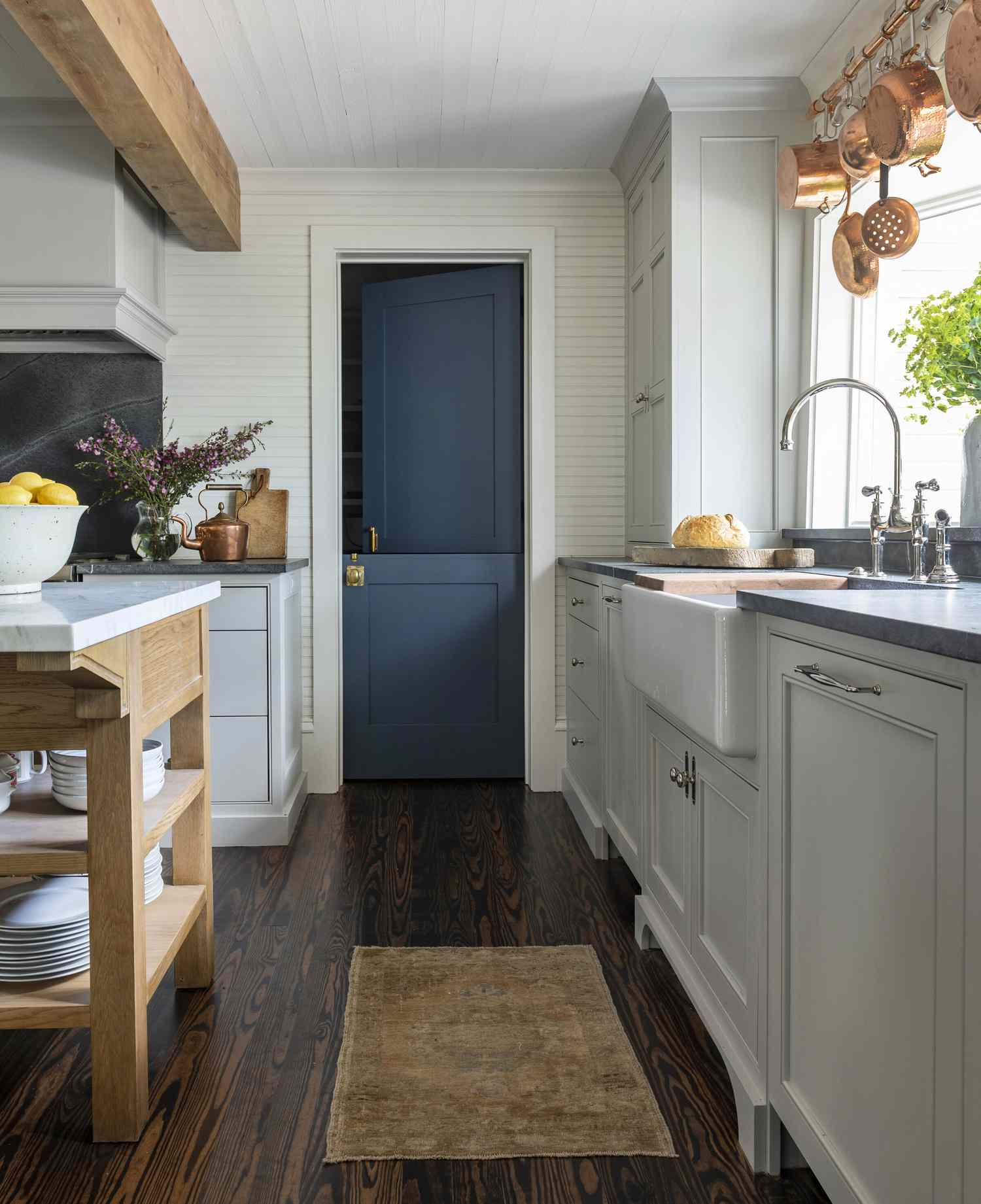 pale blue farmhouse kitchen cabinets with silver hardware