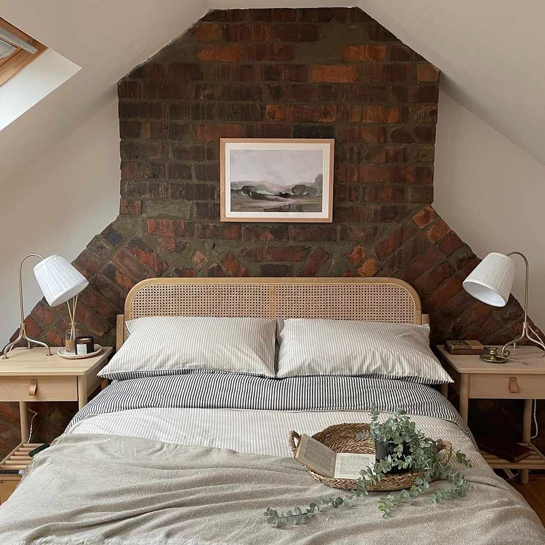 low ceiling with exposed brick wall