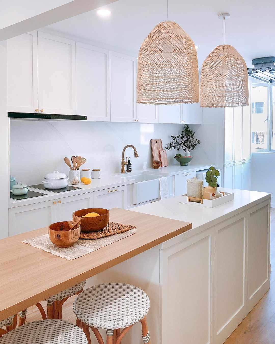 A kitchen island with an extended bar top