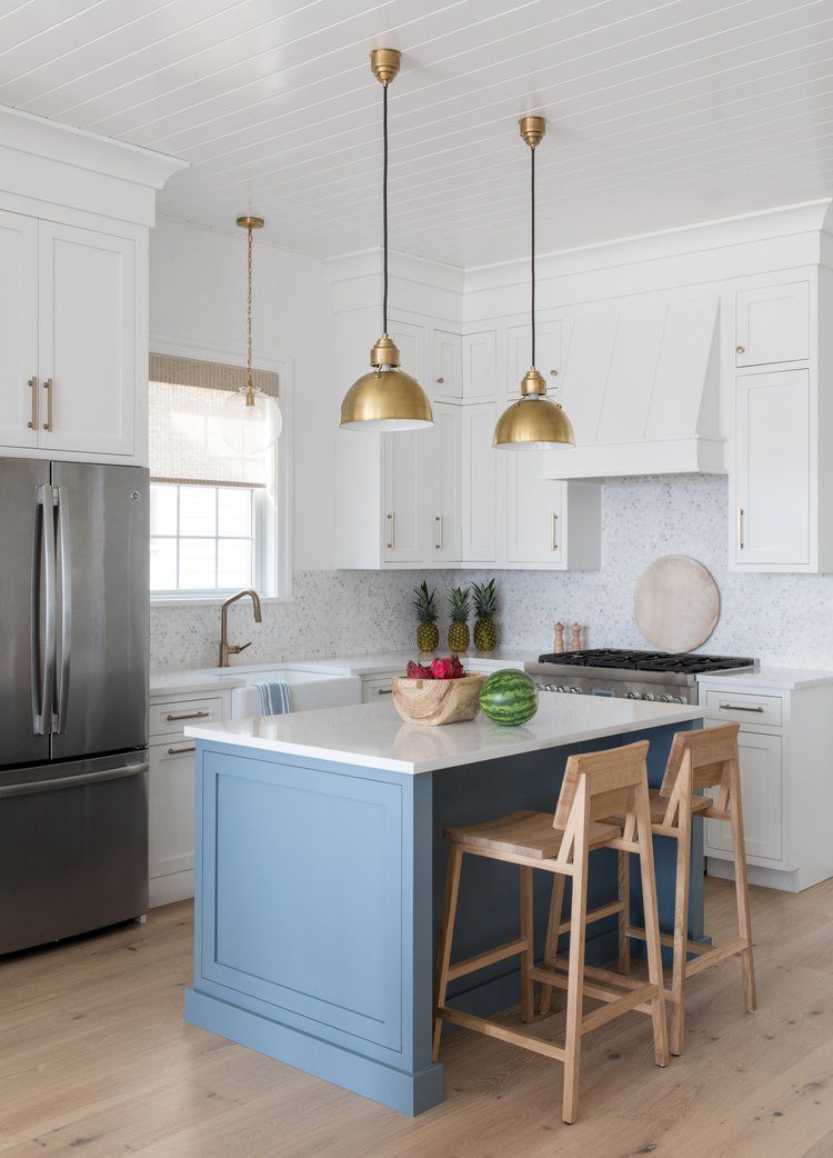 A small blue kitchen island