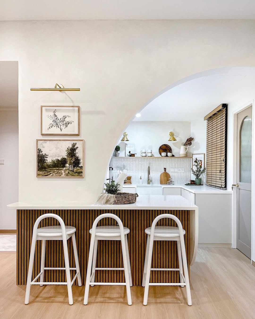 A small kitchen with a fluted island