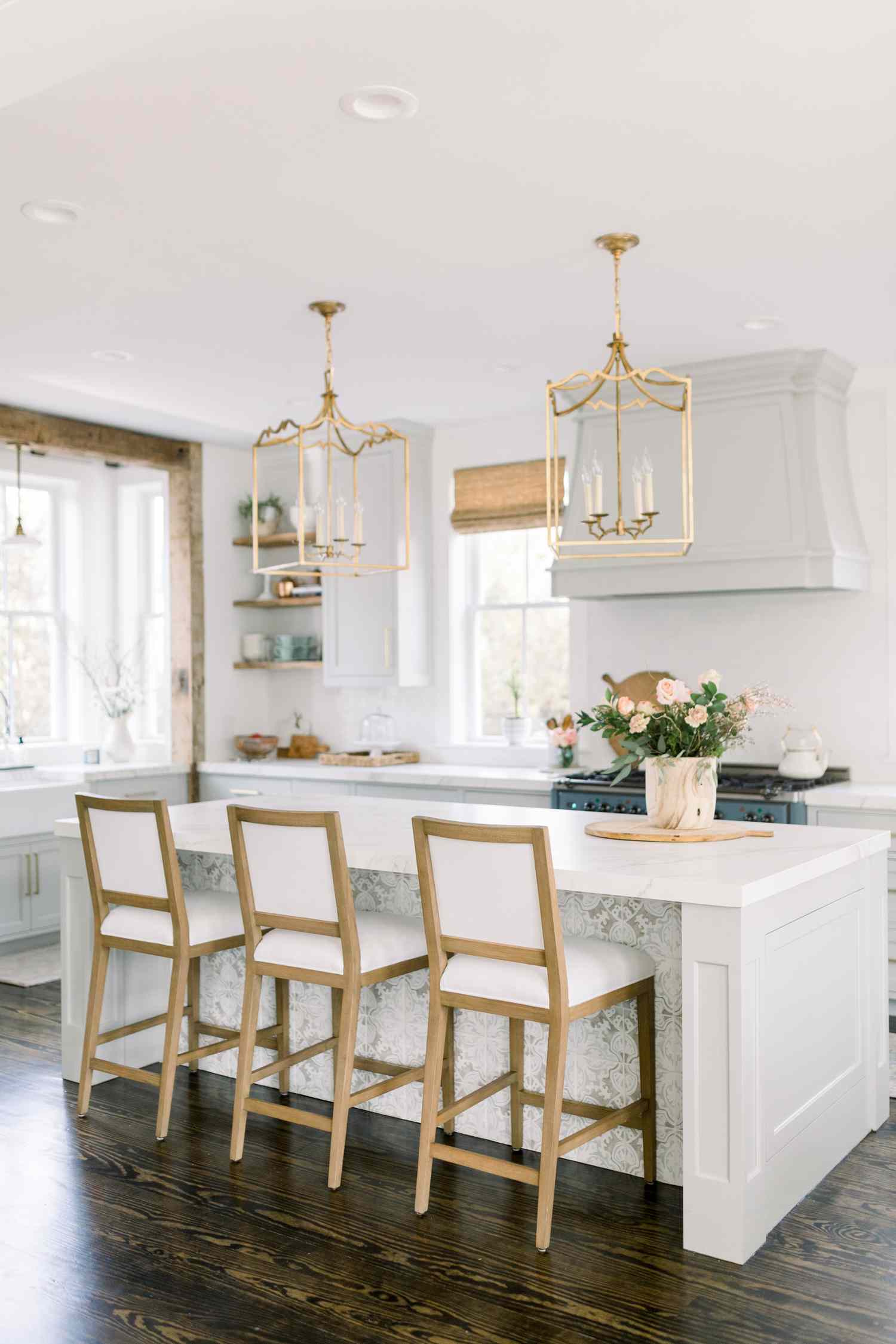 A kitchen island with tile accent