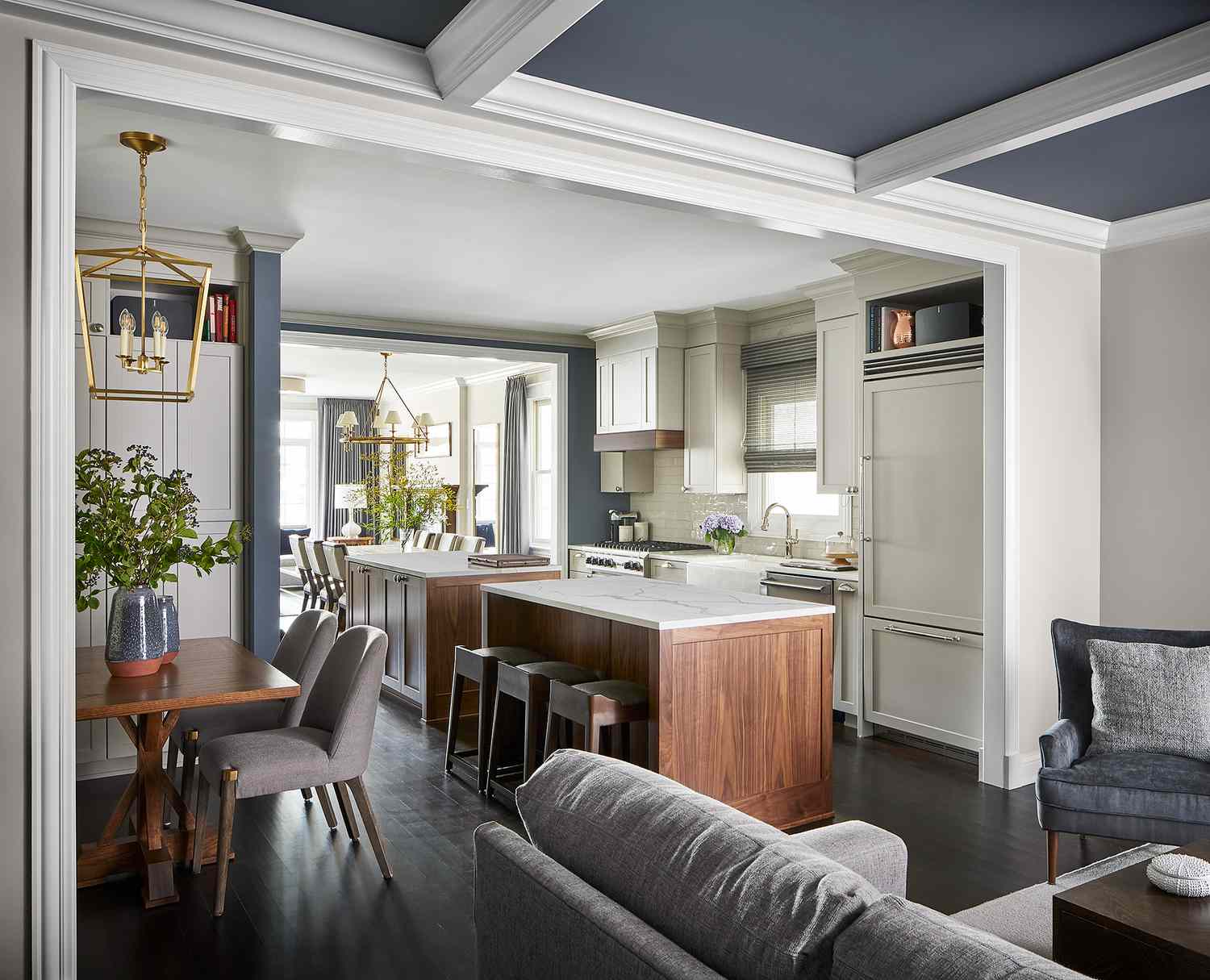 A kitchen with two islands