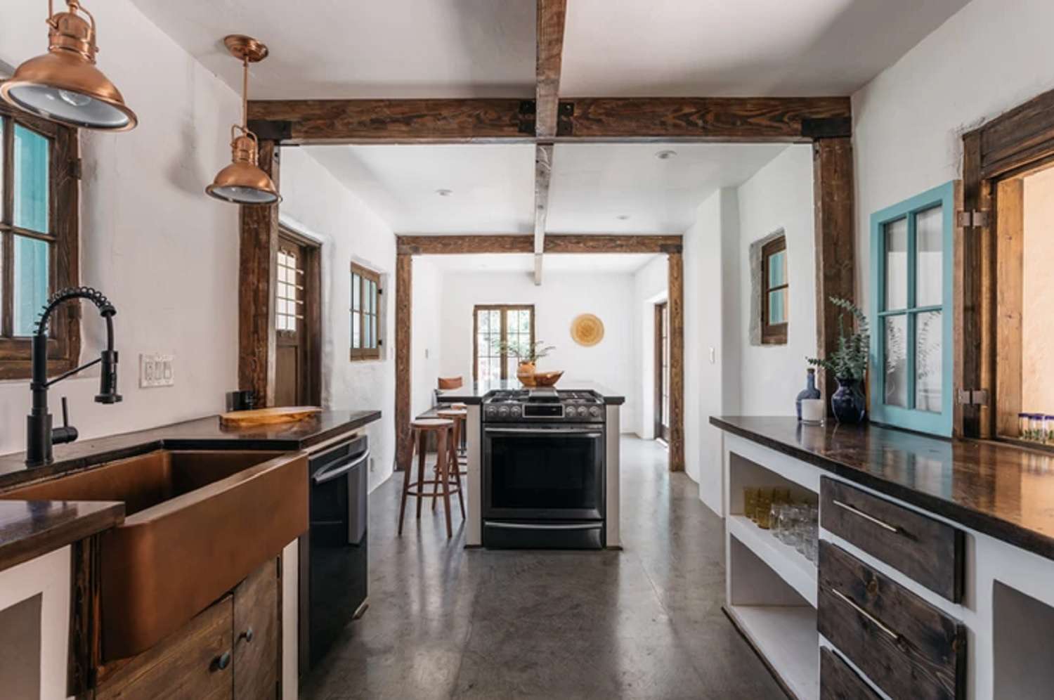A large kitchen with ceiling beams
