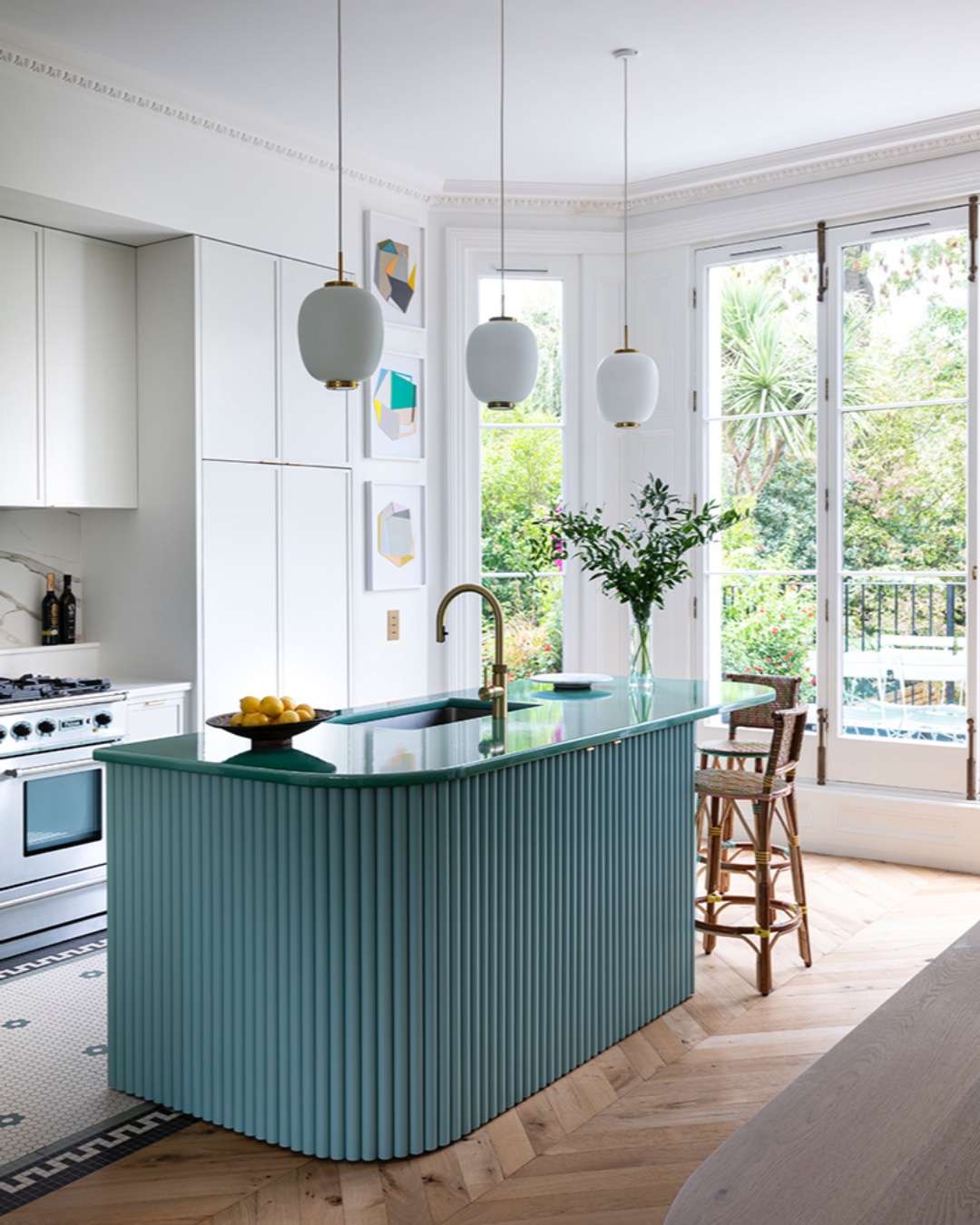 A small teal kitchen island