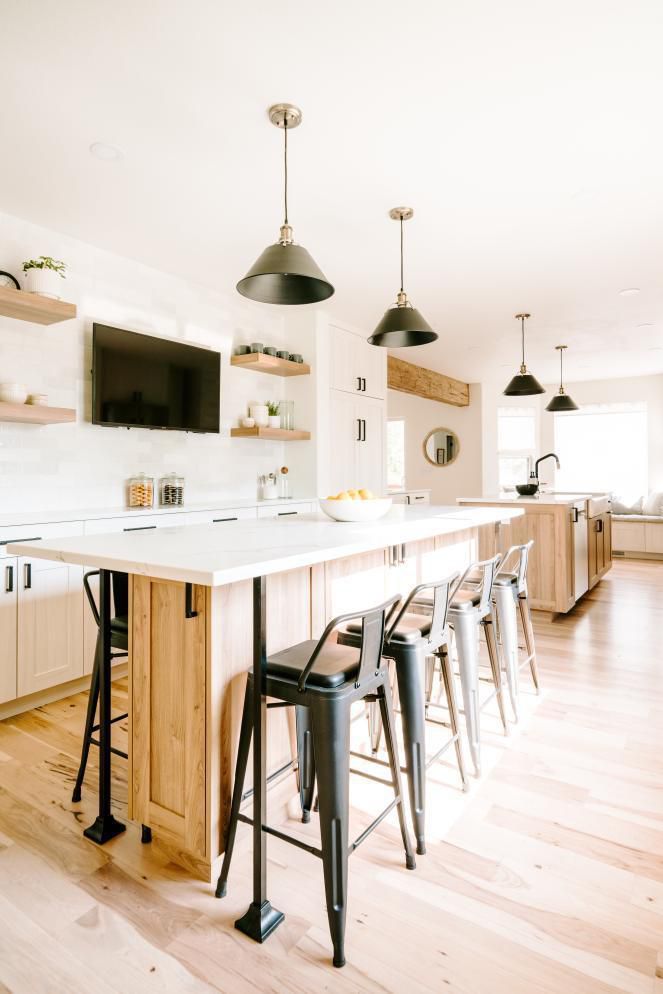 A neutral kitchen with two islands