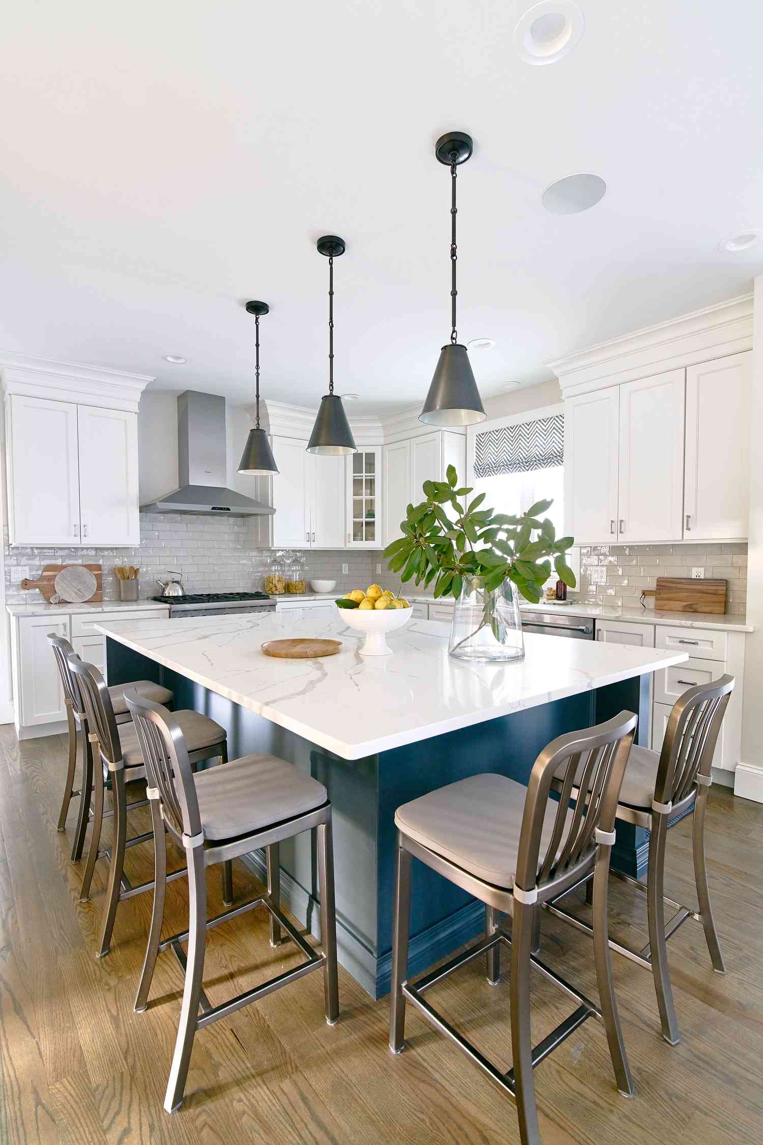 A blue kitchen island with seating