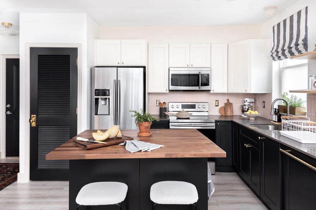 A warm wood and black kitchen