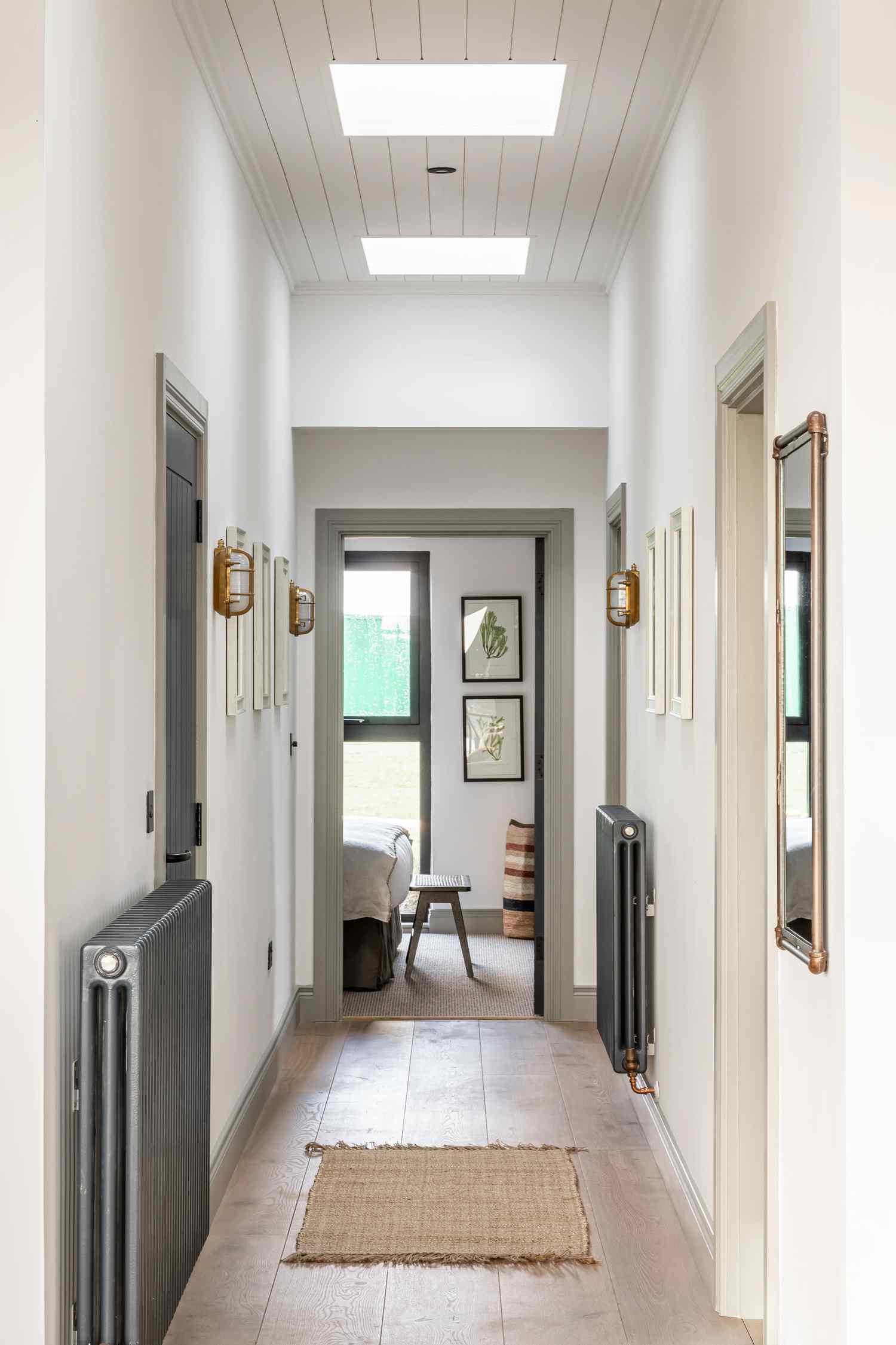 Narrow hallway with slim profile heaters on either side