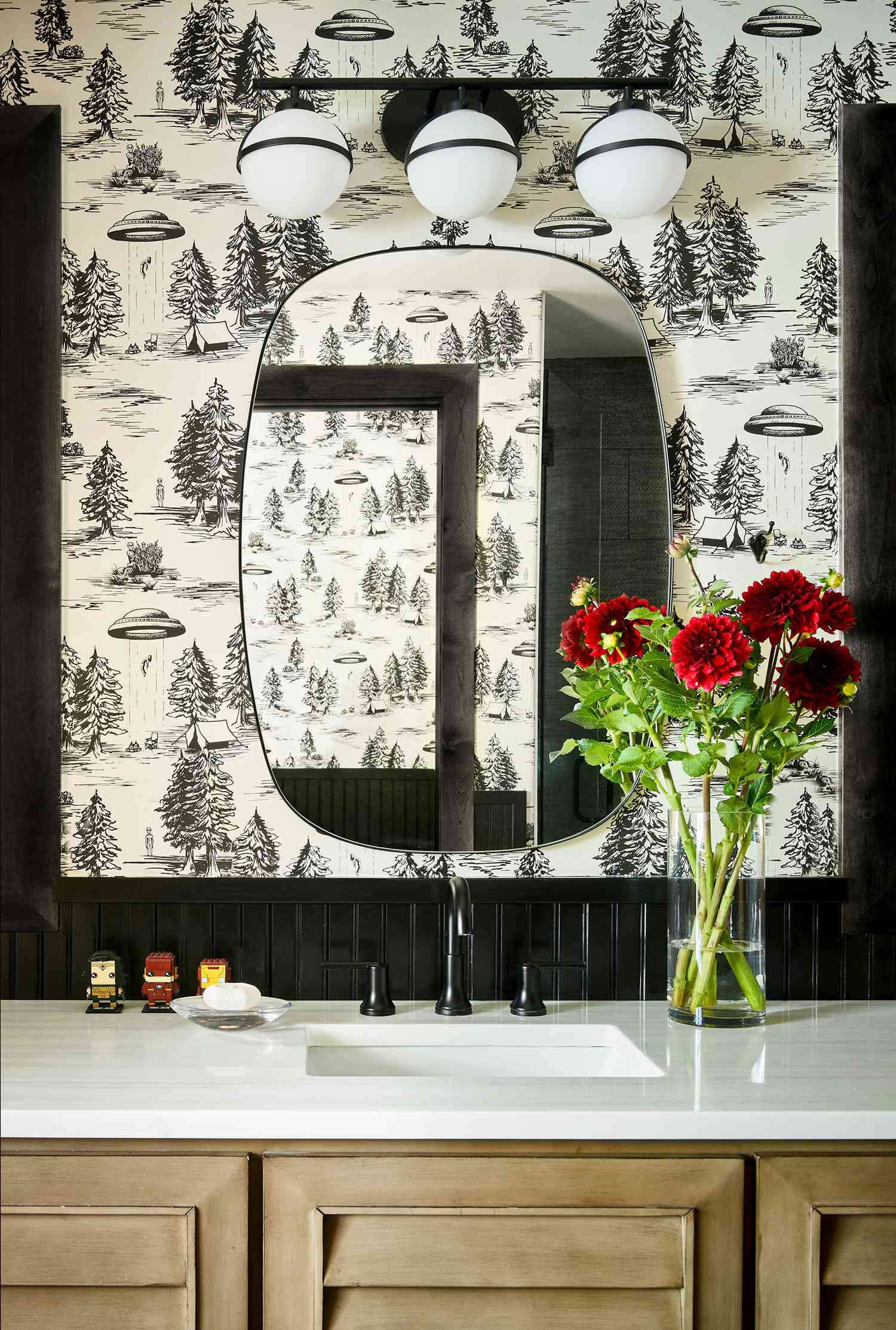 Black and white UFO wallpaper in bathroom