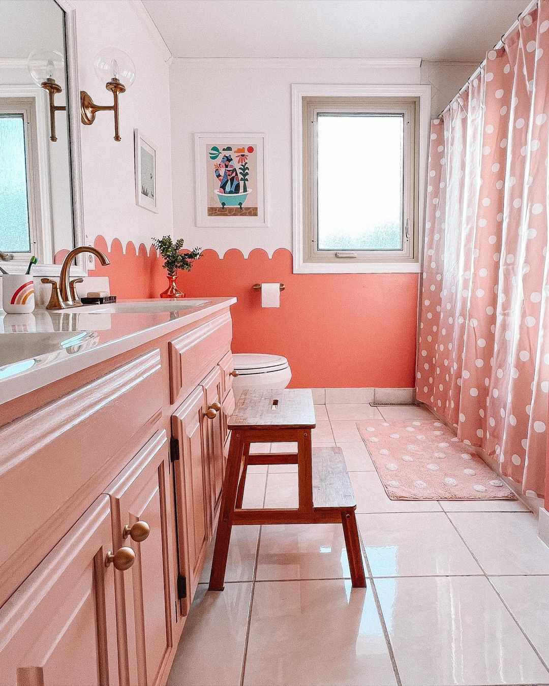 Pink bathroom with polka dot shower curtain