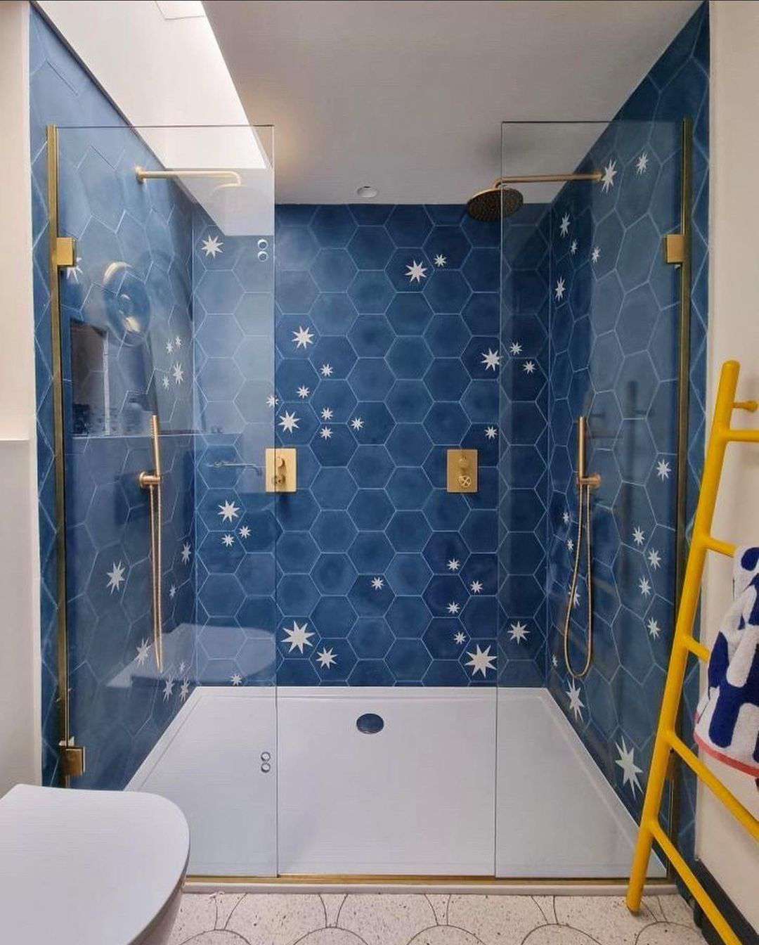 Blue shower with yellow towel ladder