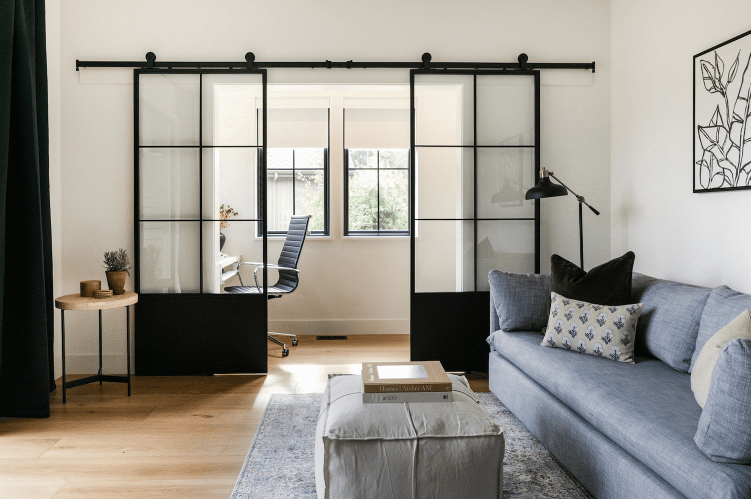 48 Small Sunroom Ideas for a Warm and Happy Space 42 Black metal and glass grid sliding doors separating living room and sunroom