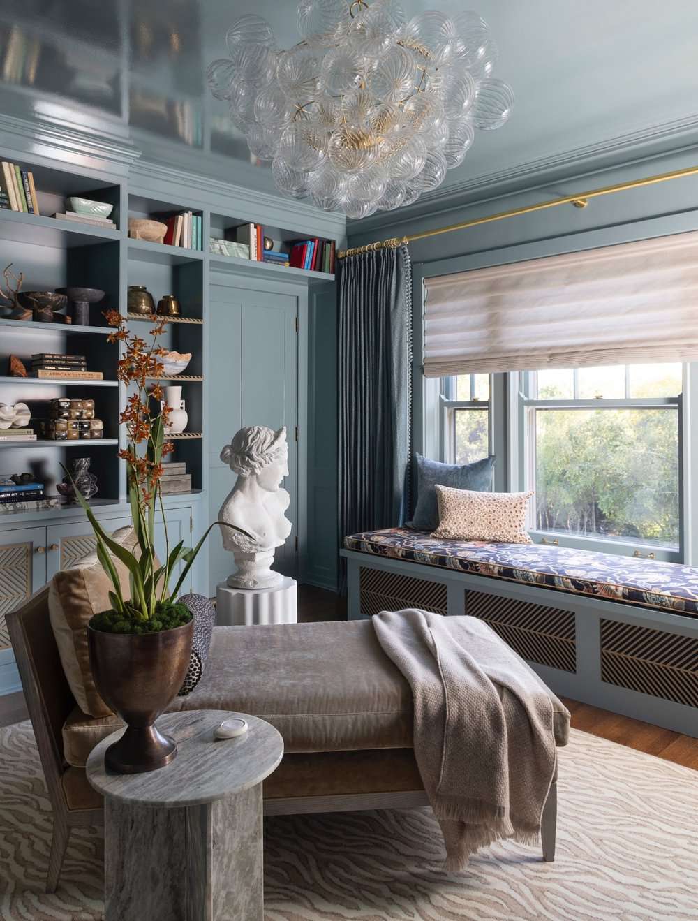 48 Small Sunroom Ideas for a Warm and Happy Space 86 Built-in window seat in a sunroom with gray-blue walls