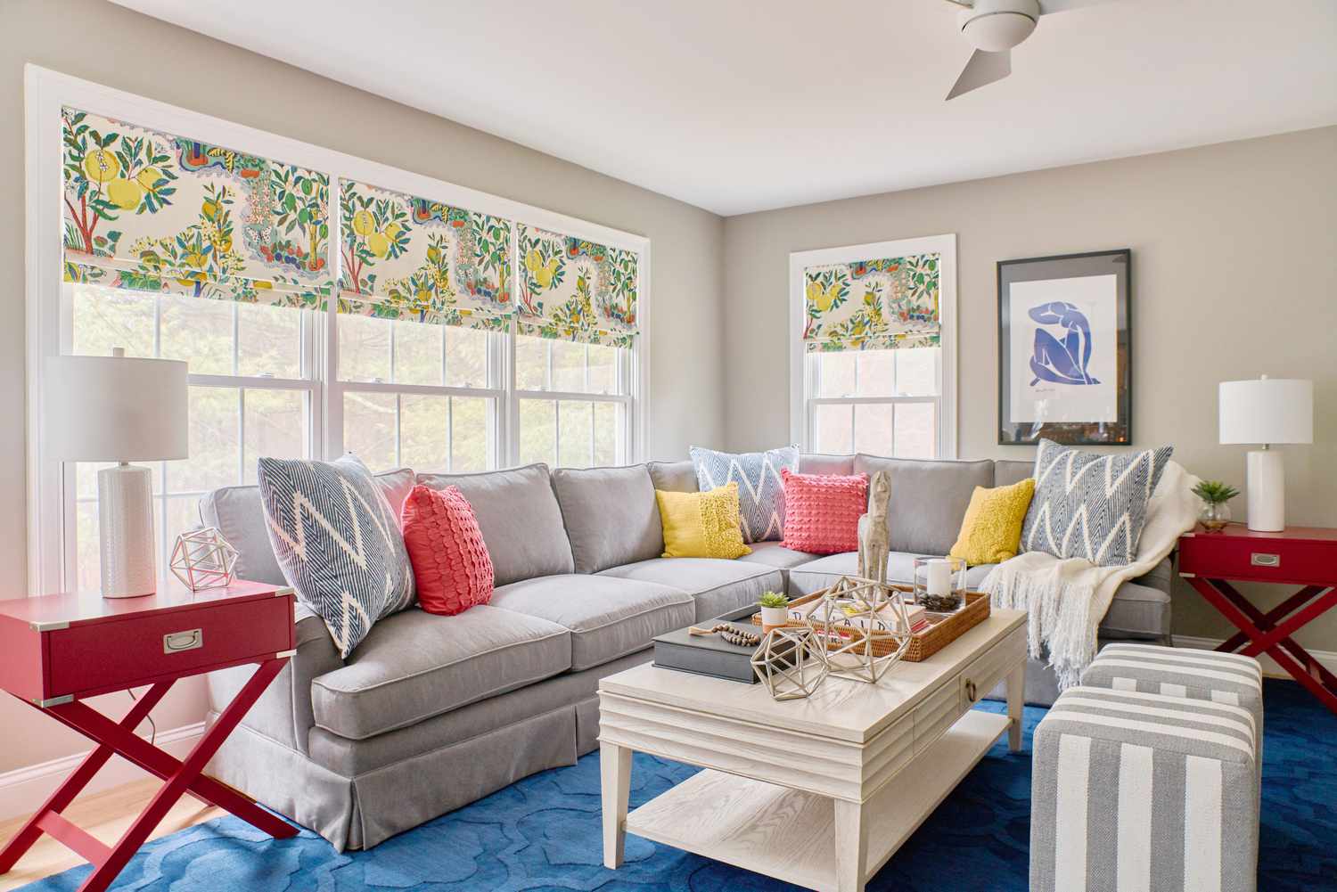 48 Small Sunroom Ideas for a Warm and Happy Space 50 Sunroom with a sectional and colorful window shades and throw pillows