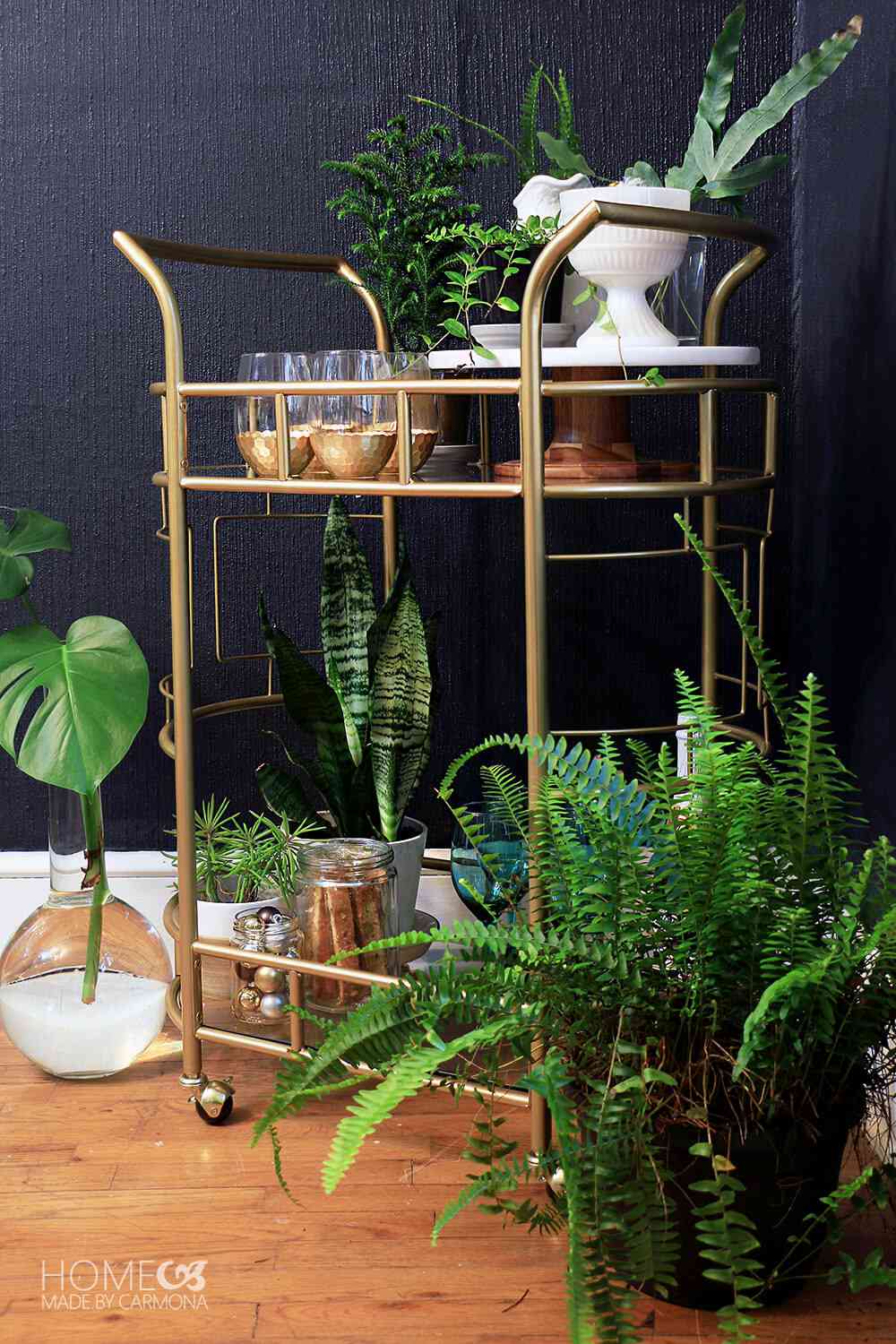 48 Small Sunroom Ideas for a Warm and Happy Space 64 Gold bar cart styled with drinkware, accessories and potted plants