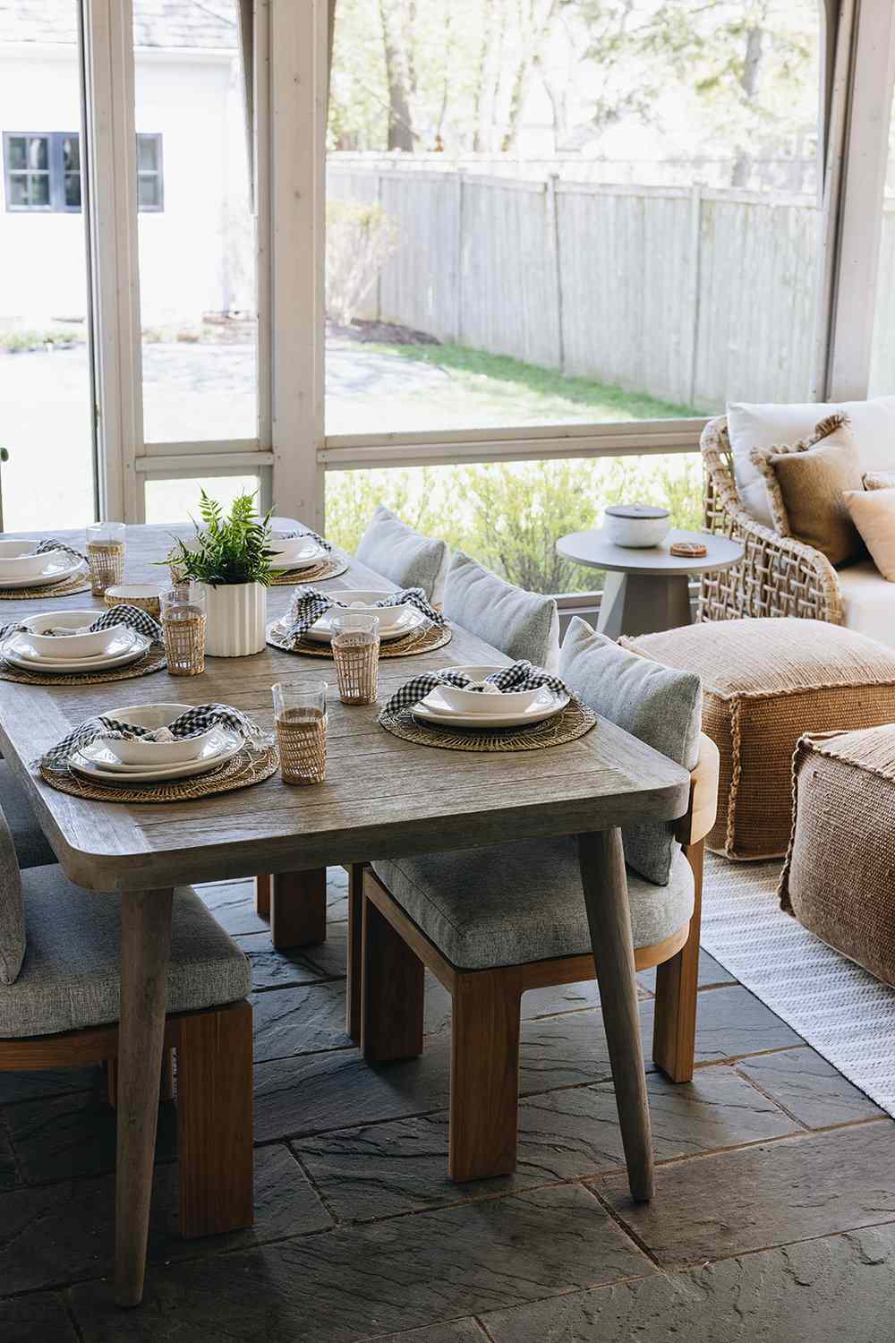 48 Small Sunroom Ideas for a Warm and Happy Space 48 Wood dining table and upholstered chairs in a modern rustic sunroom