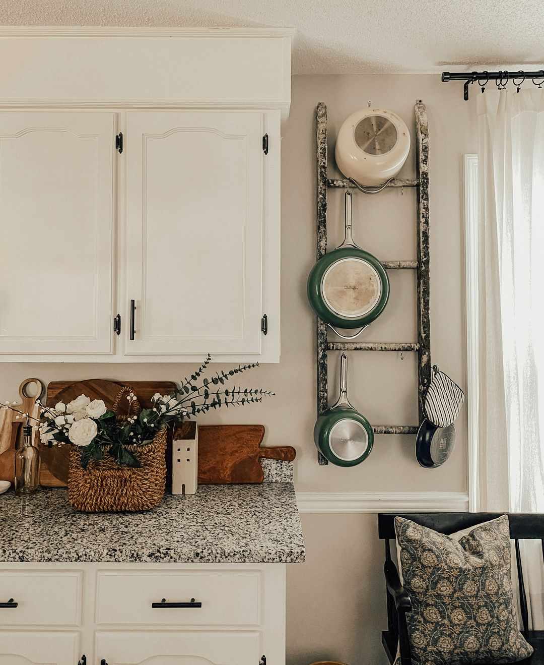 rustic ladder used to display pots