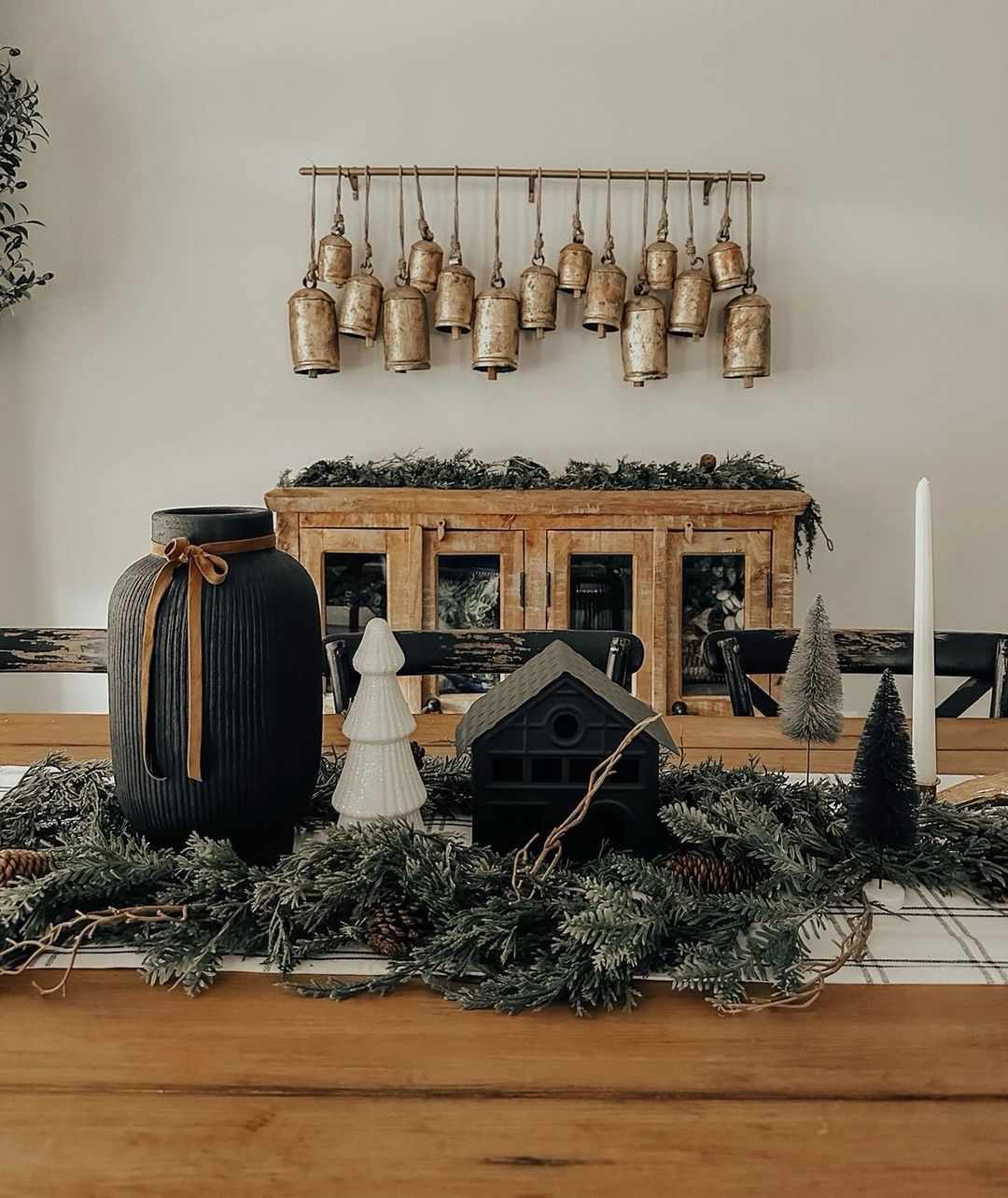 gold bells hung on dowel