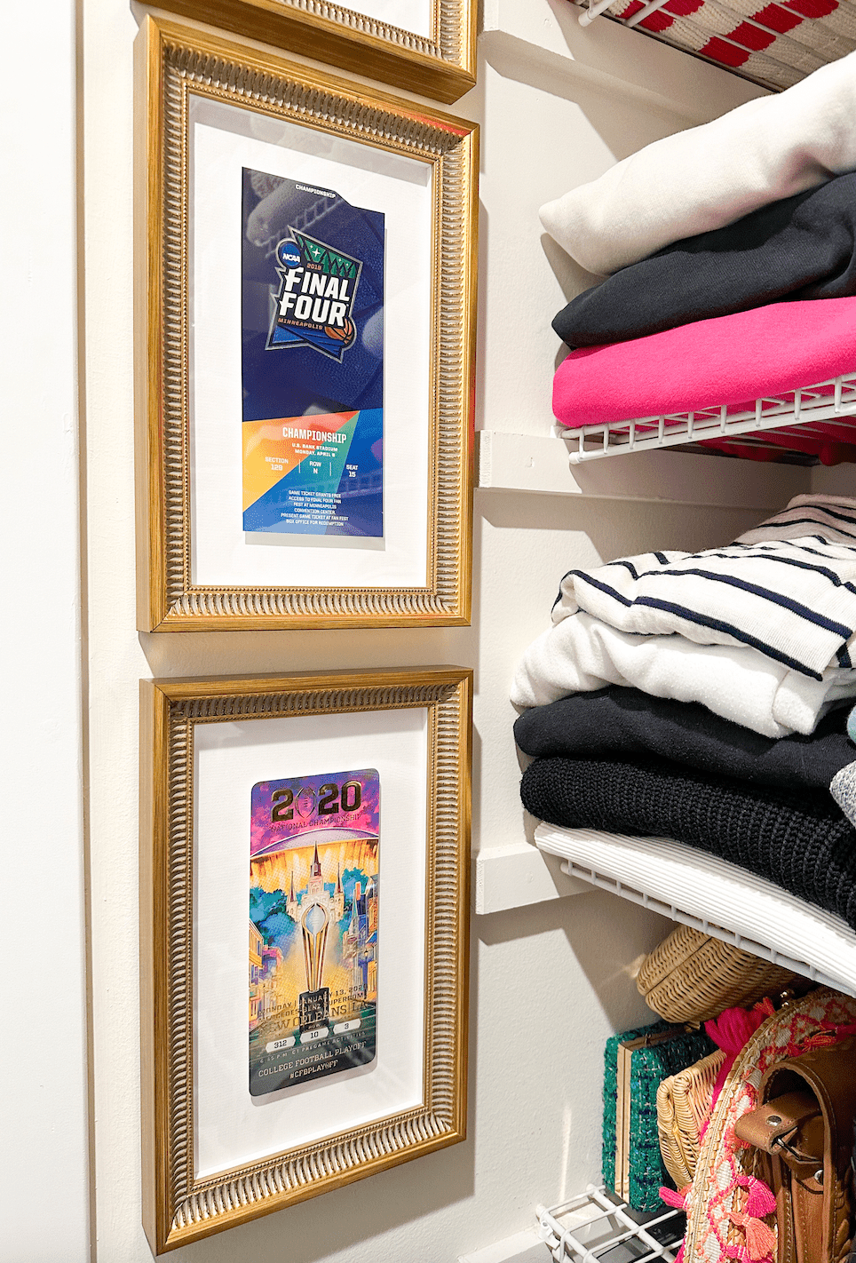framed sporting tickets in closet