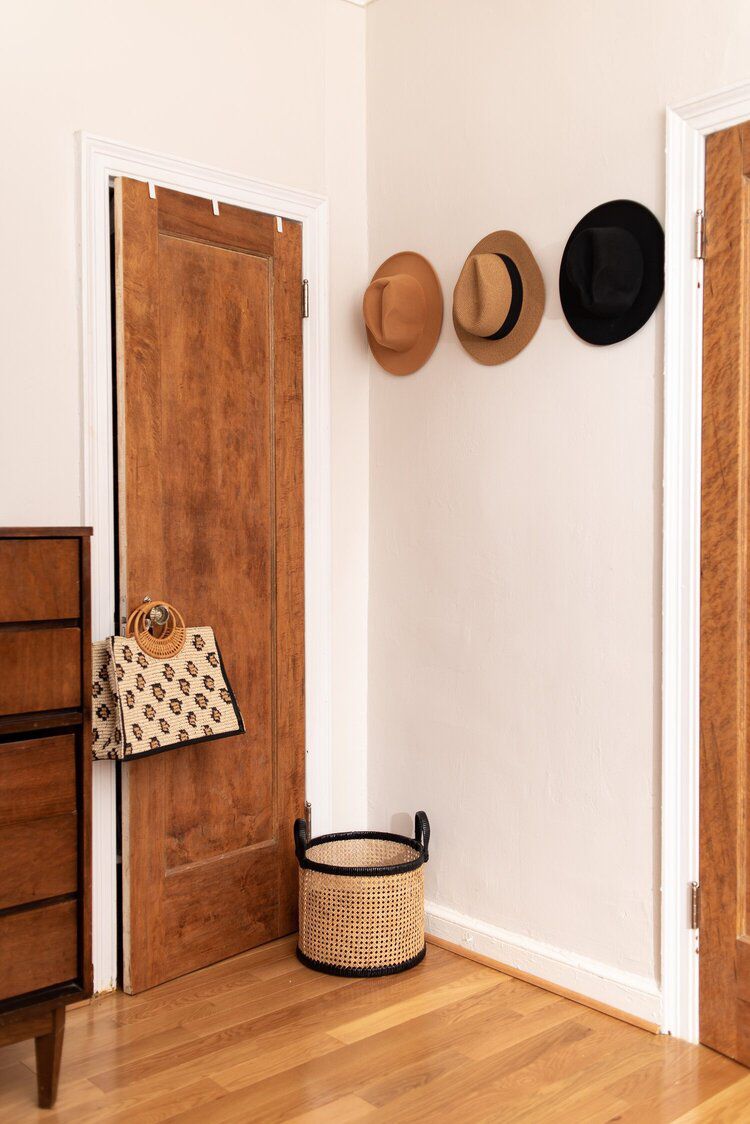 row of hats on wall