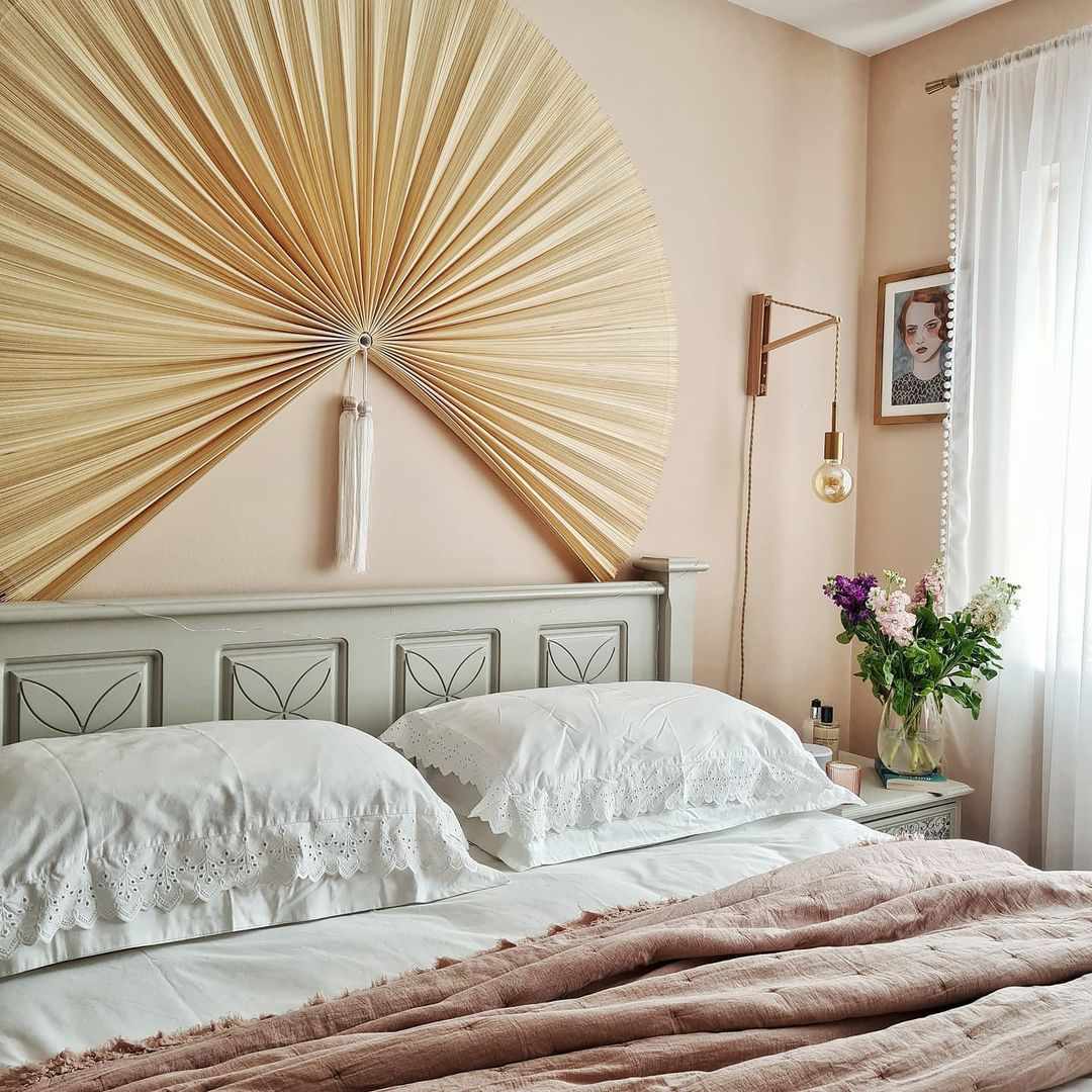 fan hanging over bed
