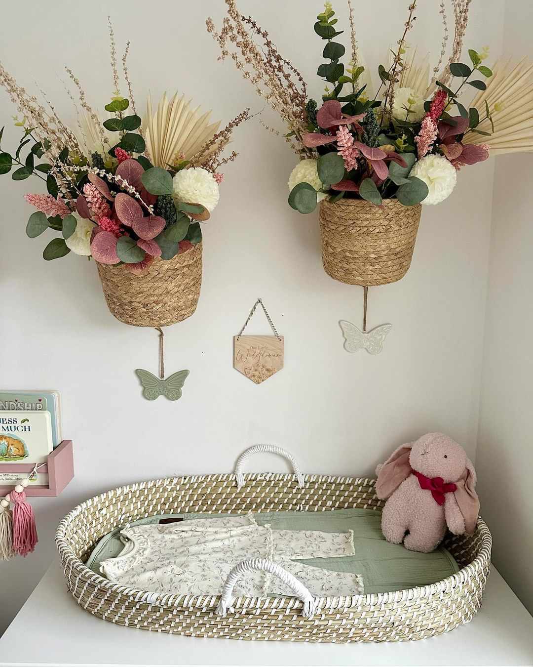 baskets filled with flowers on wall