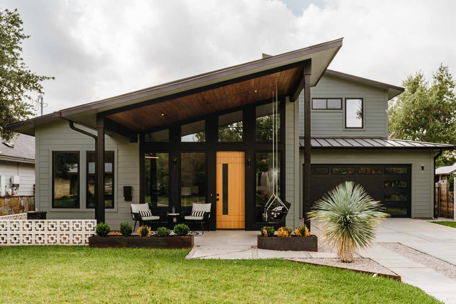 Grayish sage green home exterior paint on siding