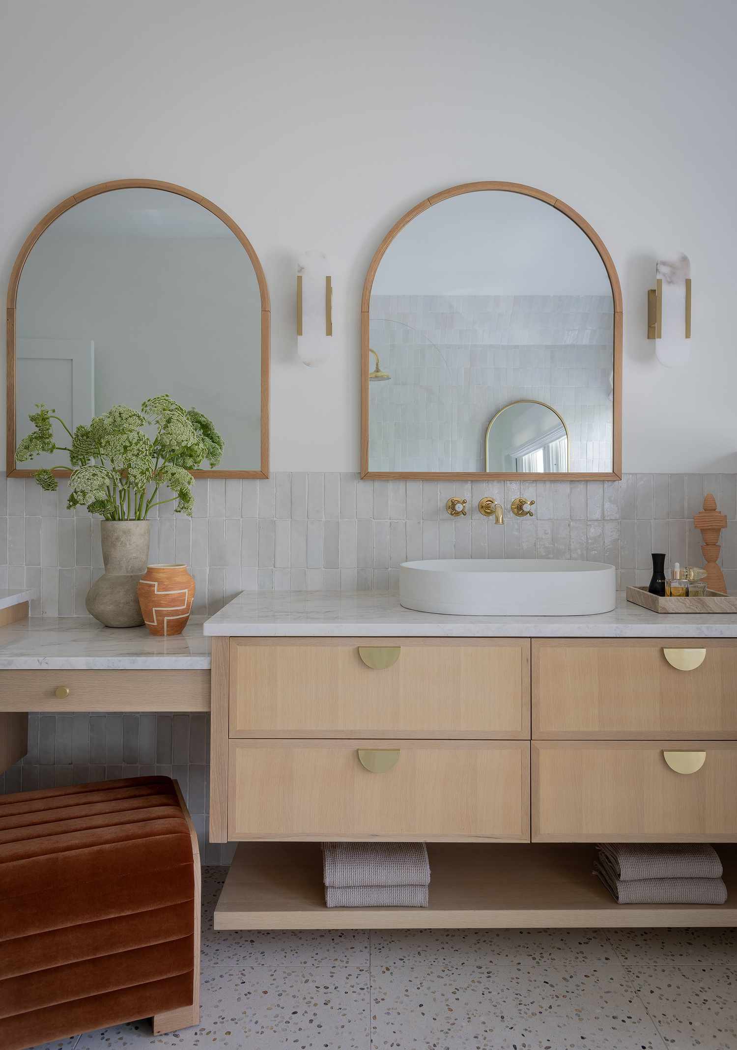 towels folded neatly below sink