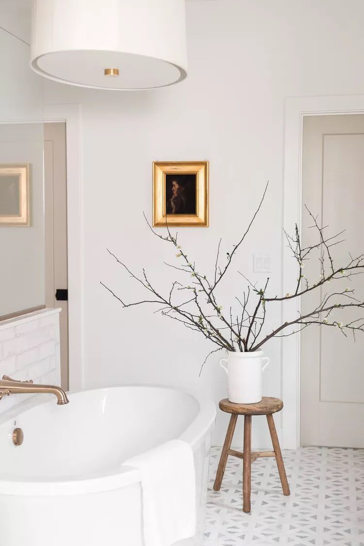 spa-like bathroom with wooden stool