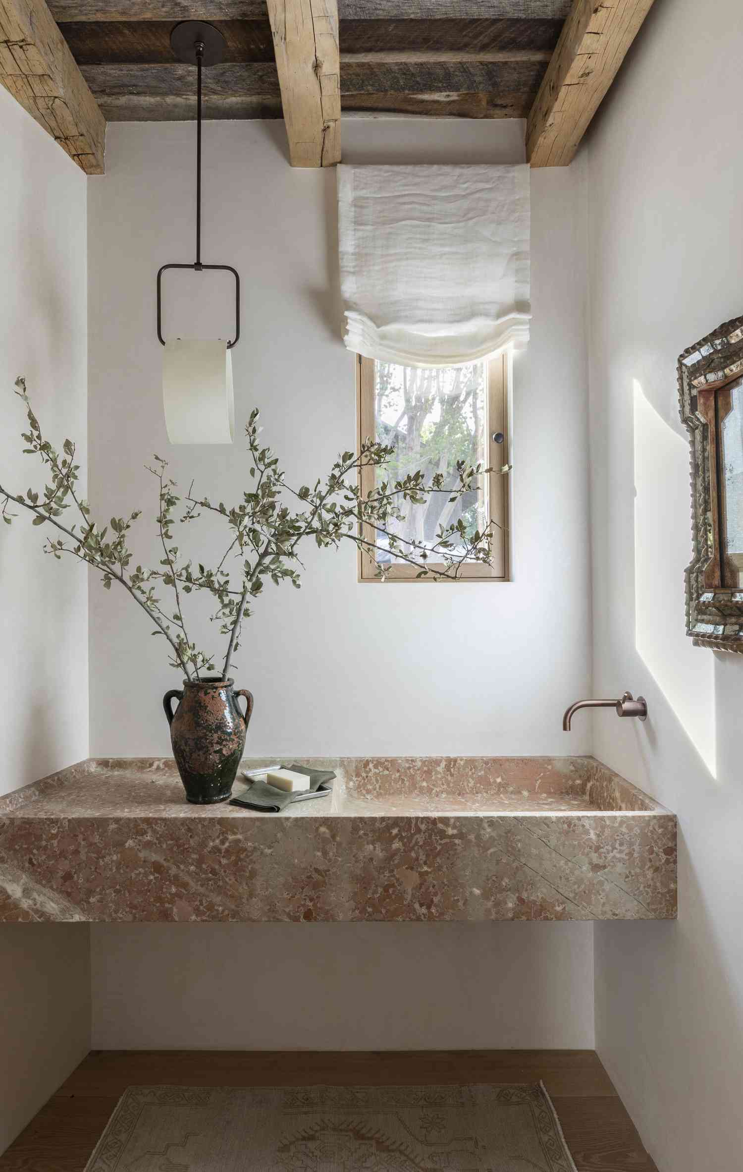 spa-like bathroom with exposed ceiling