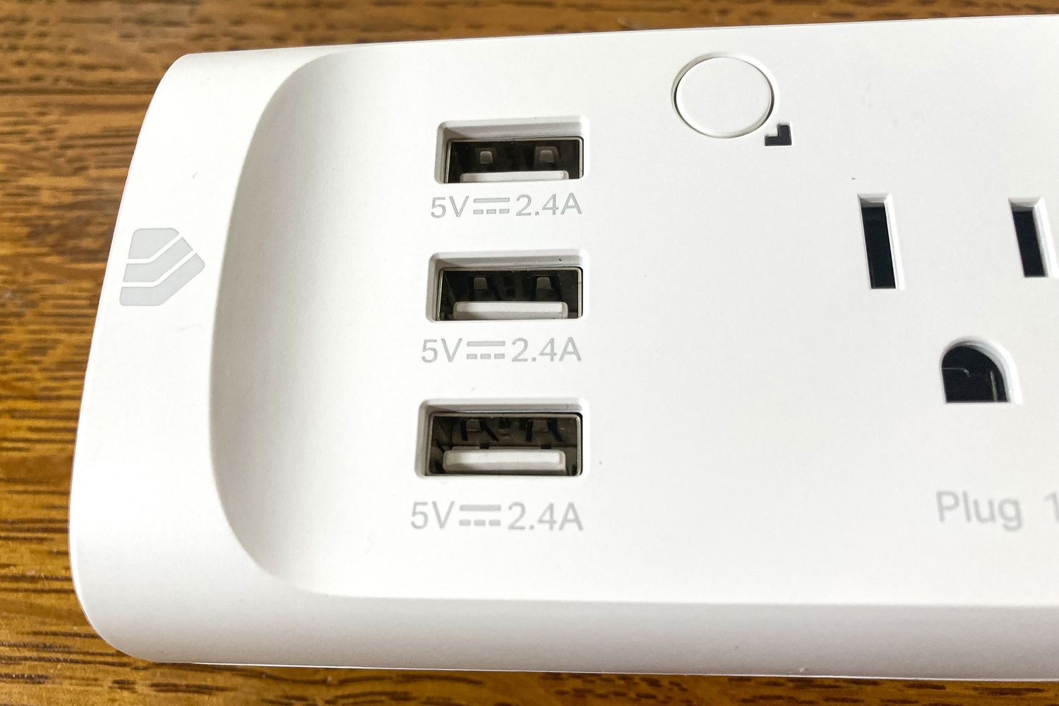 Three USB ports includes on a Kasa Smart Power Strip alongside one of the power outlets.