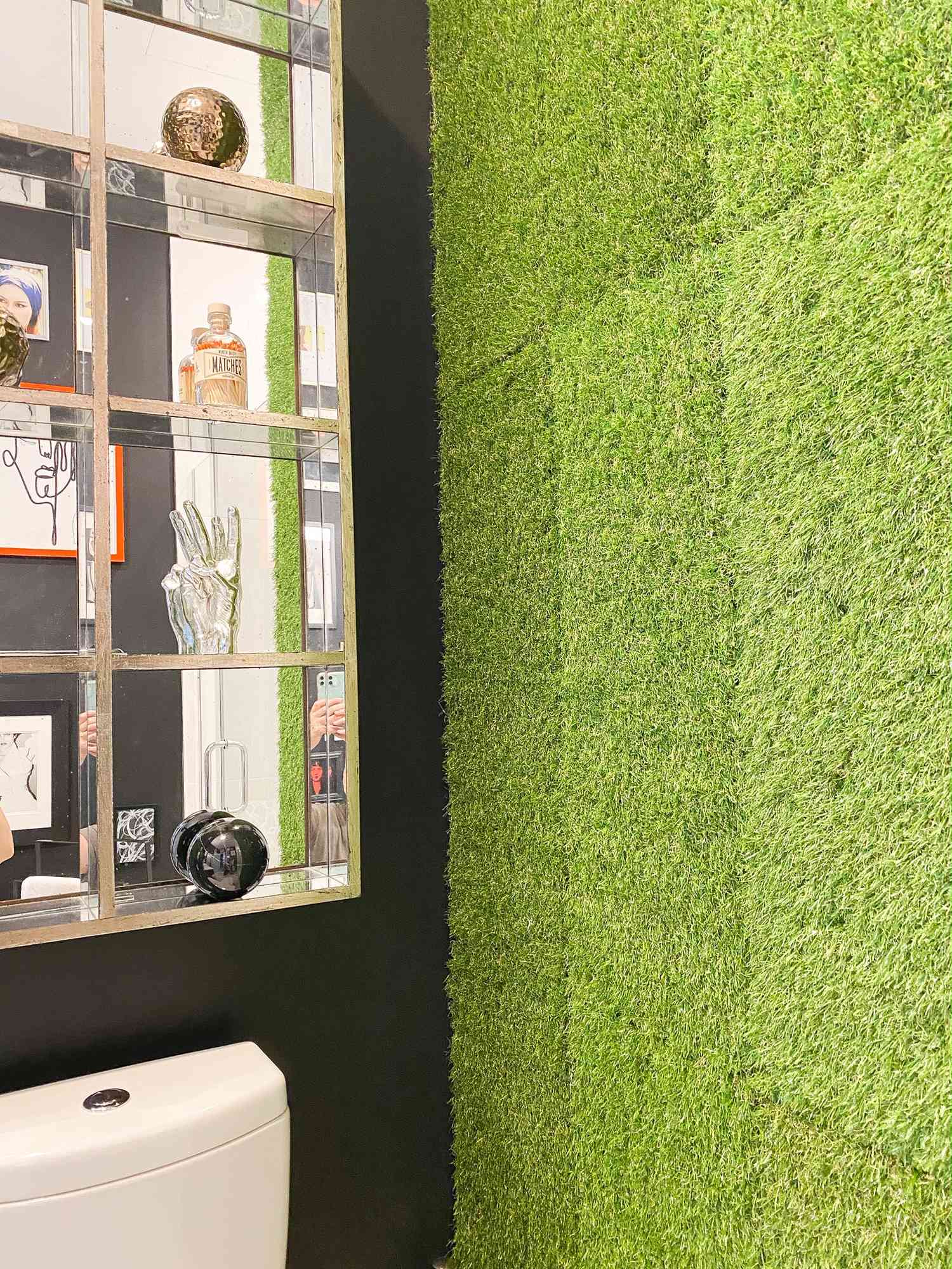 black bathroom with faux living wall