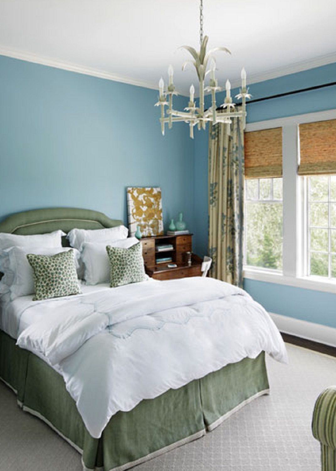 Blue walls in pretty bedroom.