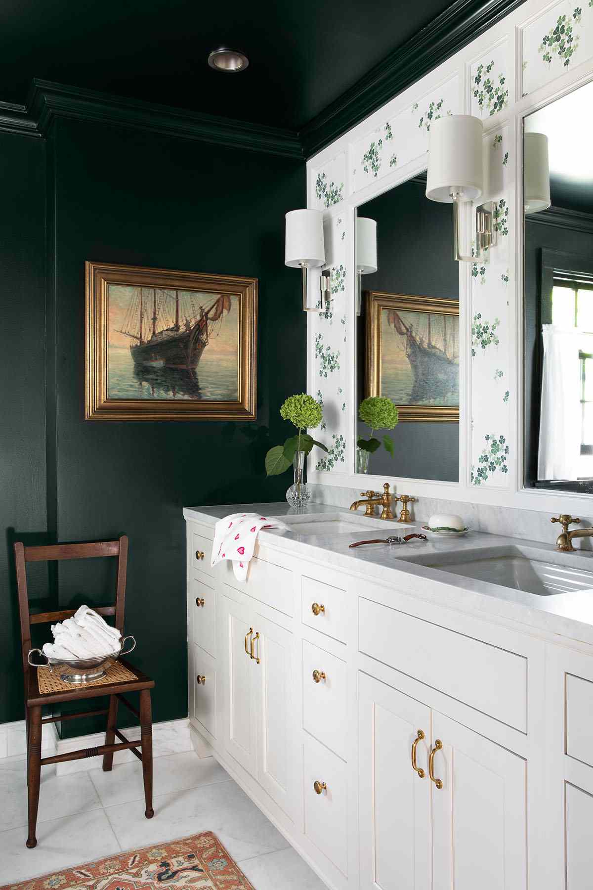 A dark green ceiling and wall in a bathroom