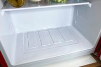 The bottom interior of the West Bend Mini Fridge with Freezer