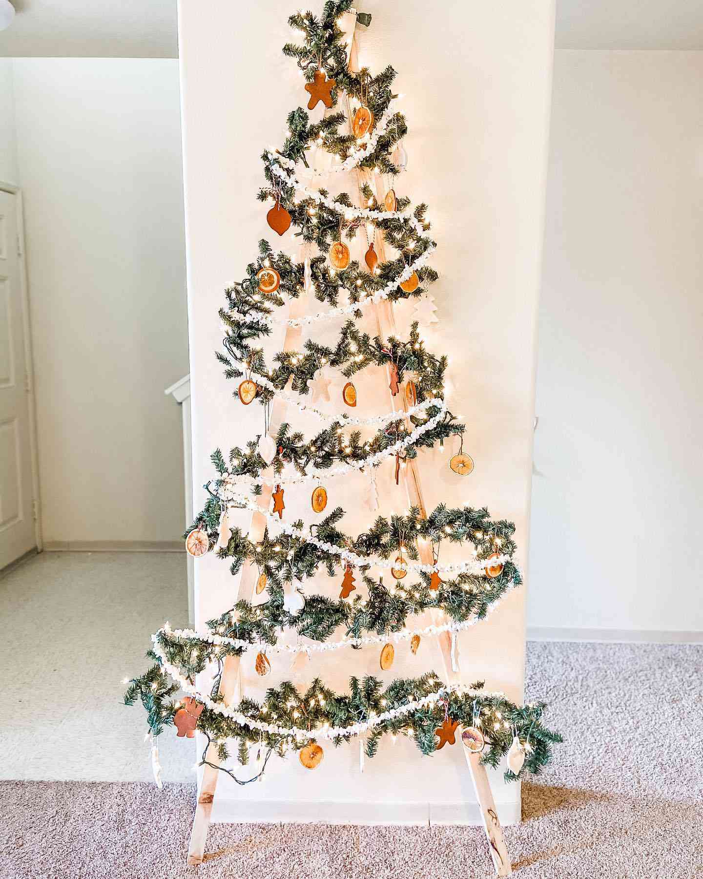 A wood ladder tree decorated like a Christmas tree