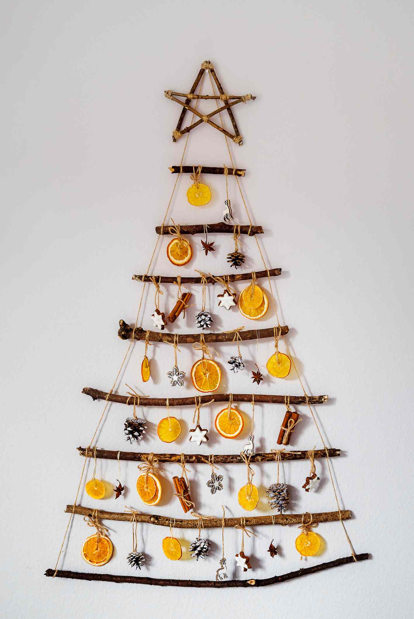 An all natural tree made with branches and dried fruit