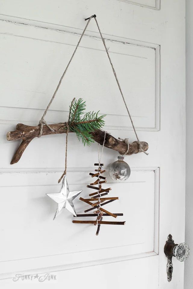 A tree branch hanging and decorated for Christmas