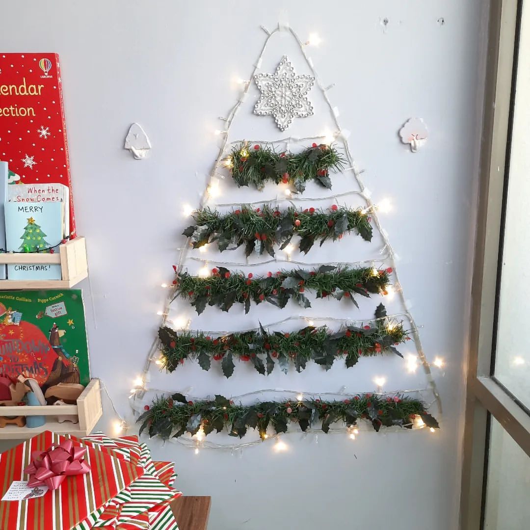 A DIY Christmas tree made from faux branches and string lights