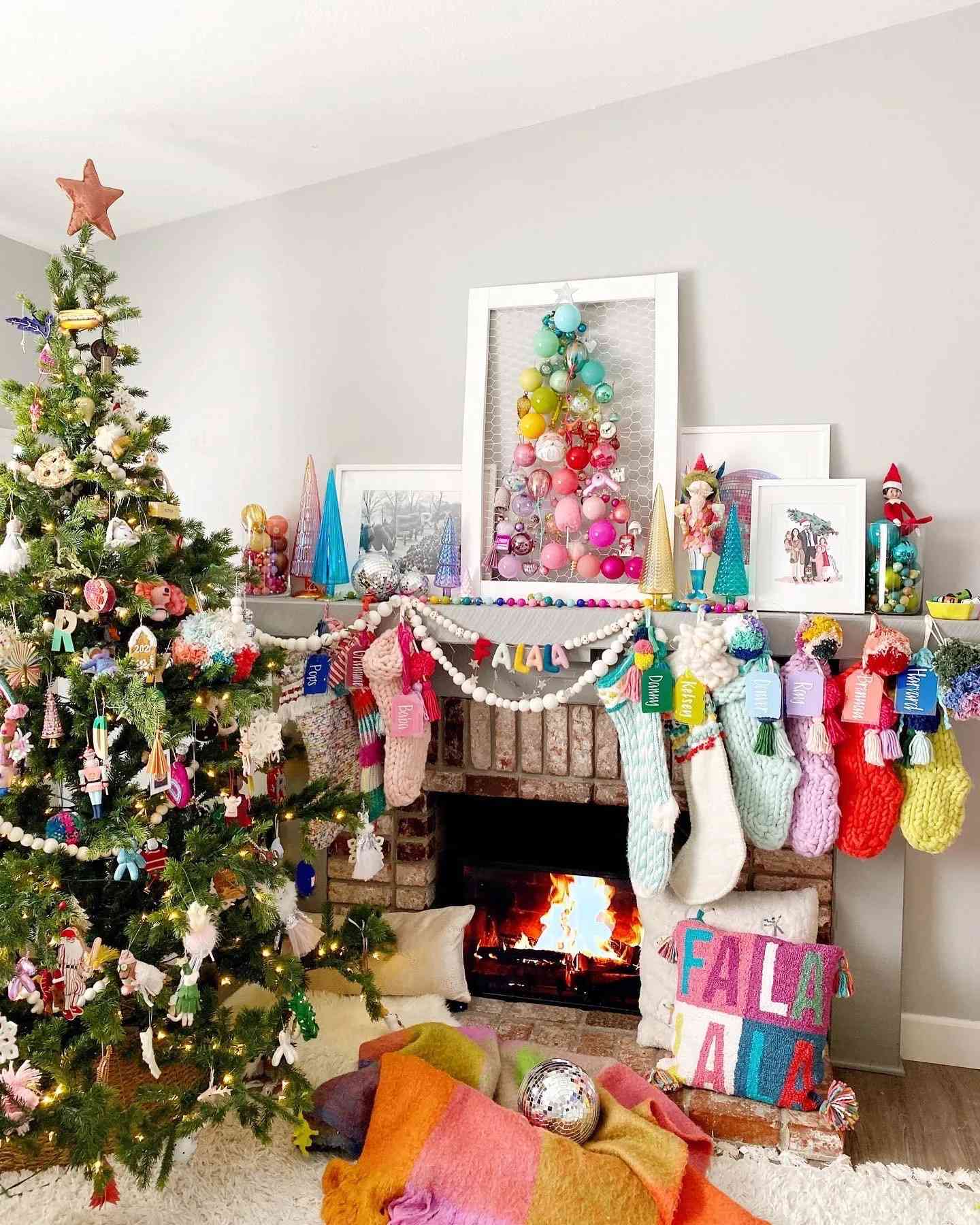 A chicken wire frame with colorful baubles in a Christmas tree shape 