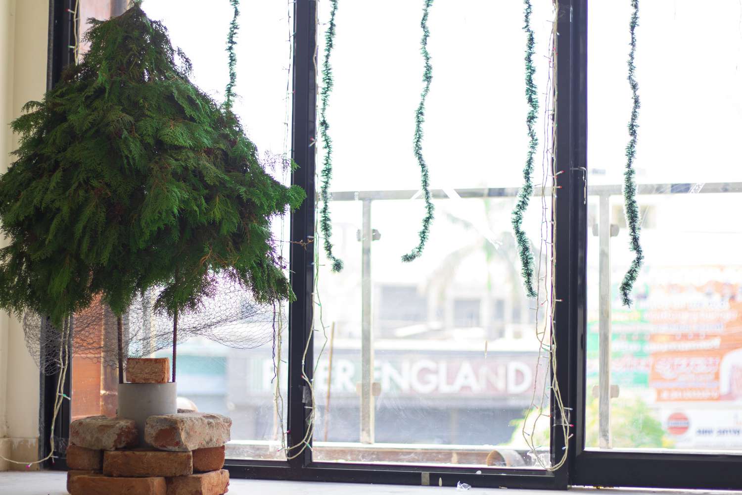 A makeshift Christmas tree made from branches and chicken wire