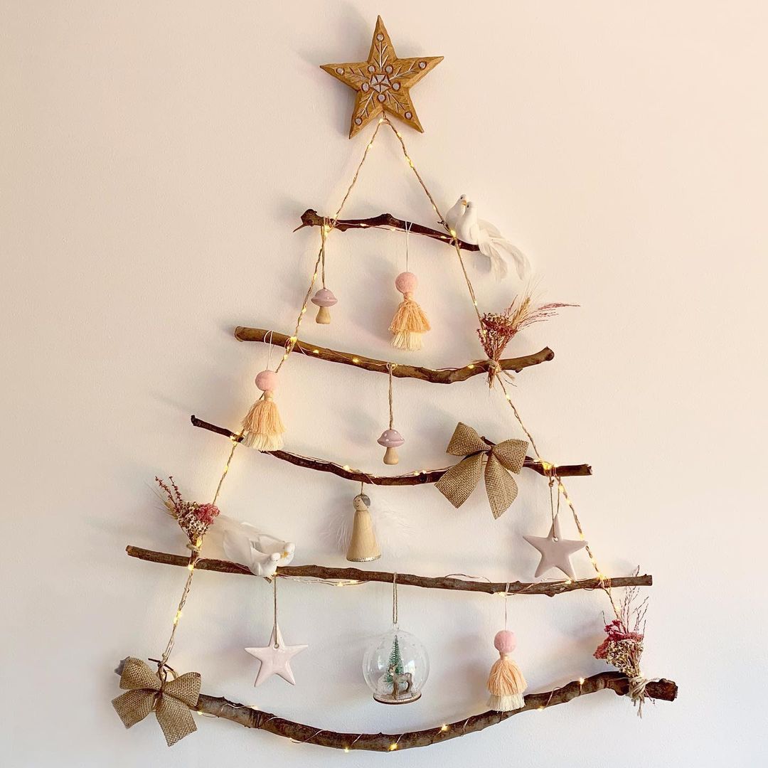 A hanging DIY Christmas tree made from branches