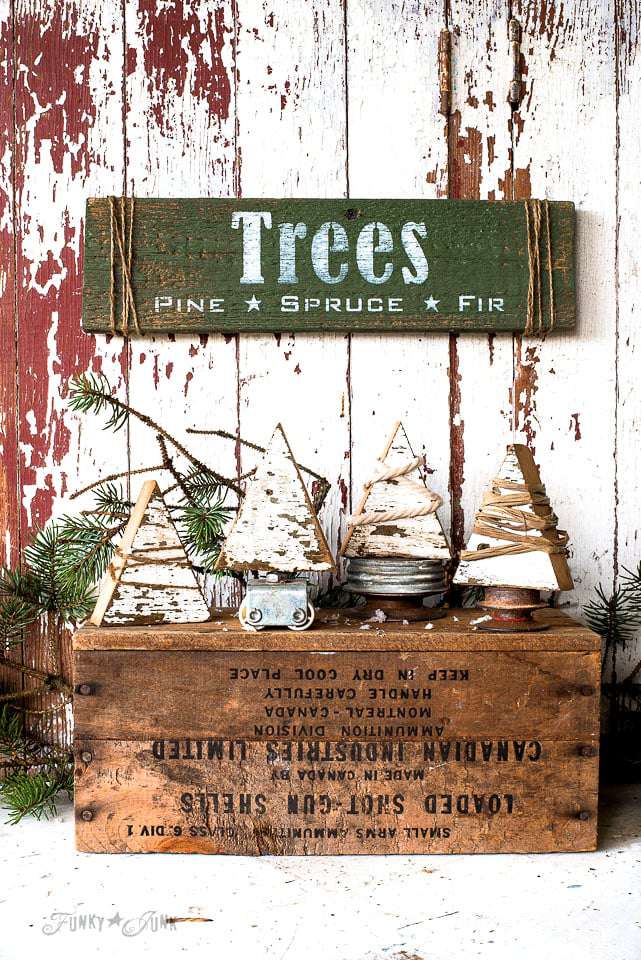 Small wooden Christmas trees wrapped in twine and rope